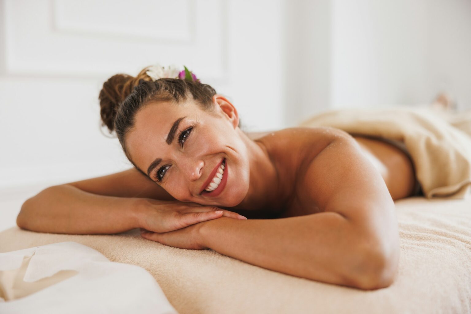 Woman Enjoying Massage In Spa Centre